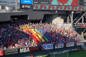 The Bailey (FC Cincinnati's fan section) waving rainbow flags and holding colored banners in tribute to the Orlando shooting.